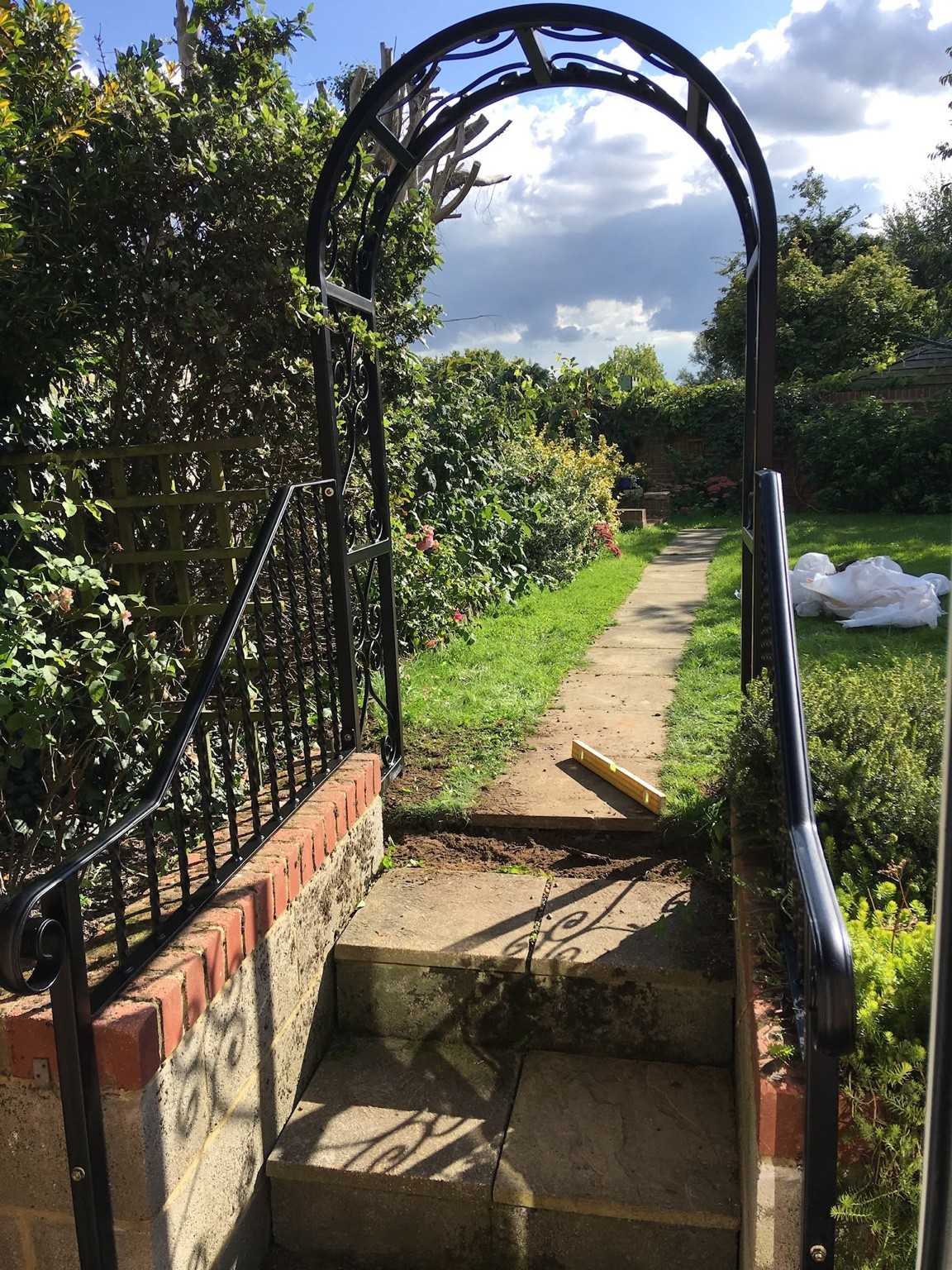 Garden arch spanning the steps with matching railing panels fitted in Snodland
